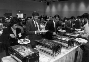 People eating at a buffet (yum)